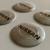 original.jpeg 4 pcs (Set) 56mm - 2.20inch Silver Nissan Wheel Center Hub Caps Stickers